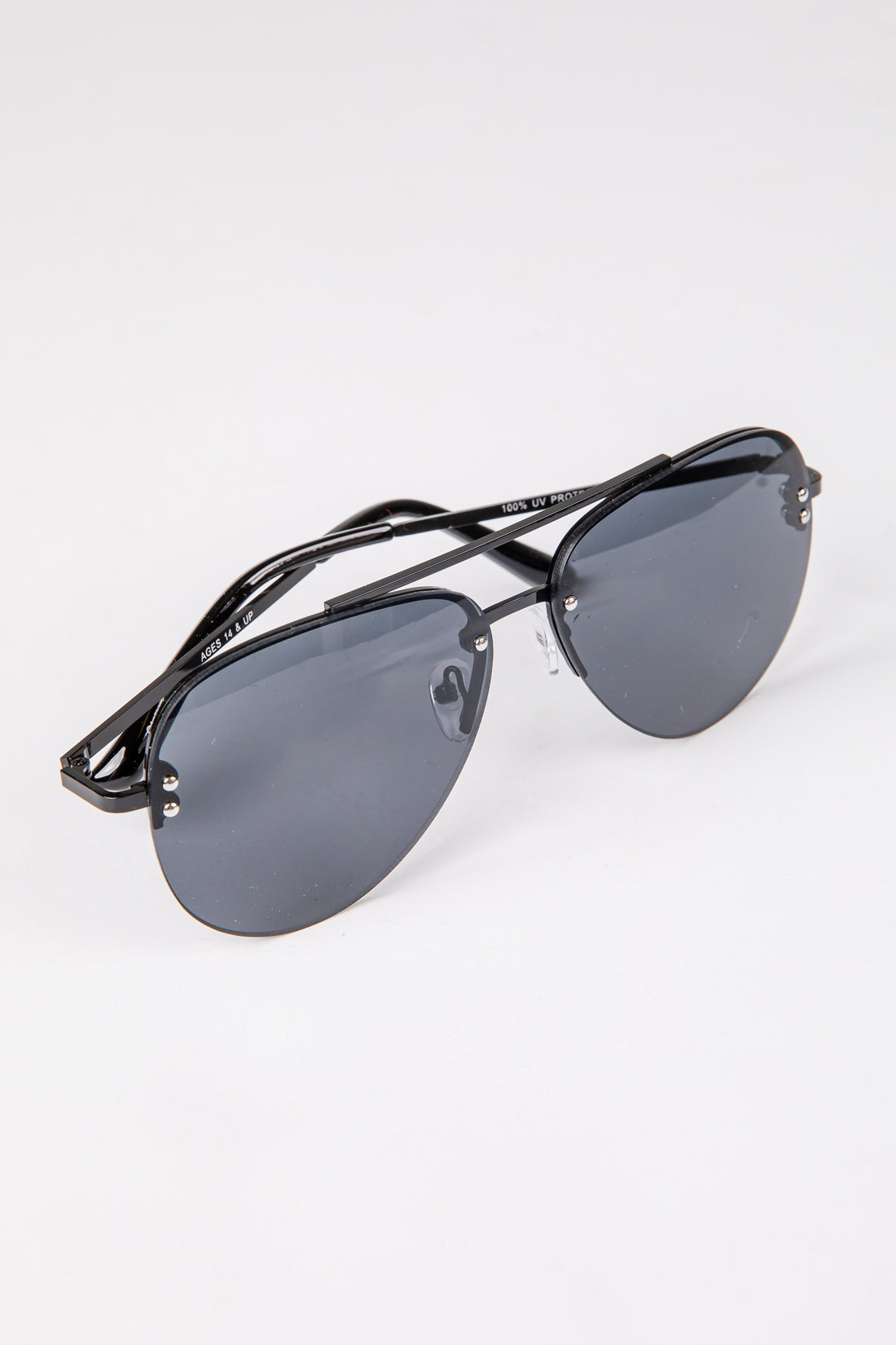 Black sunglasses with gray lenses on a white background