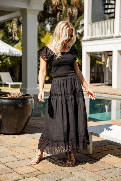 Black tiered maxi skirt styled outdoors