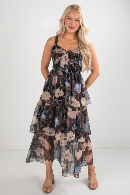 Woman wearing a floral dress against a white background