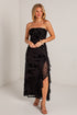 black midi dress features a tonal floral burnout design, delicate strapless fit, and a softly ruffled neckline