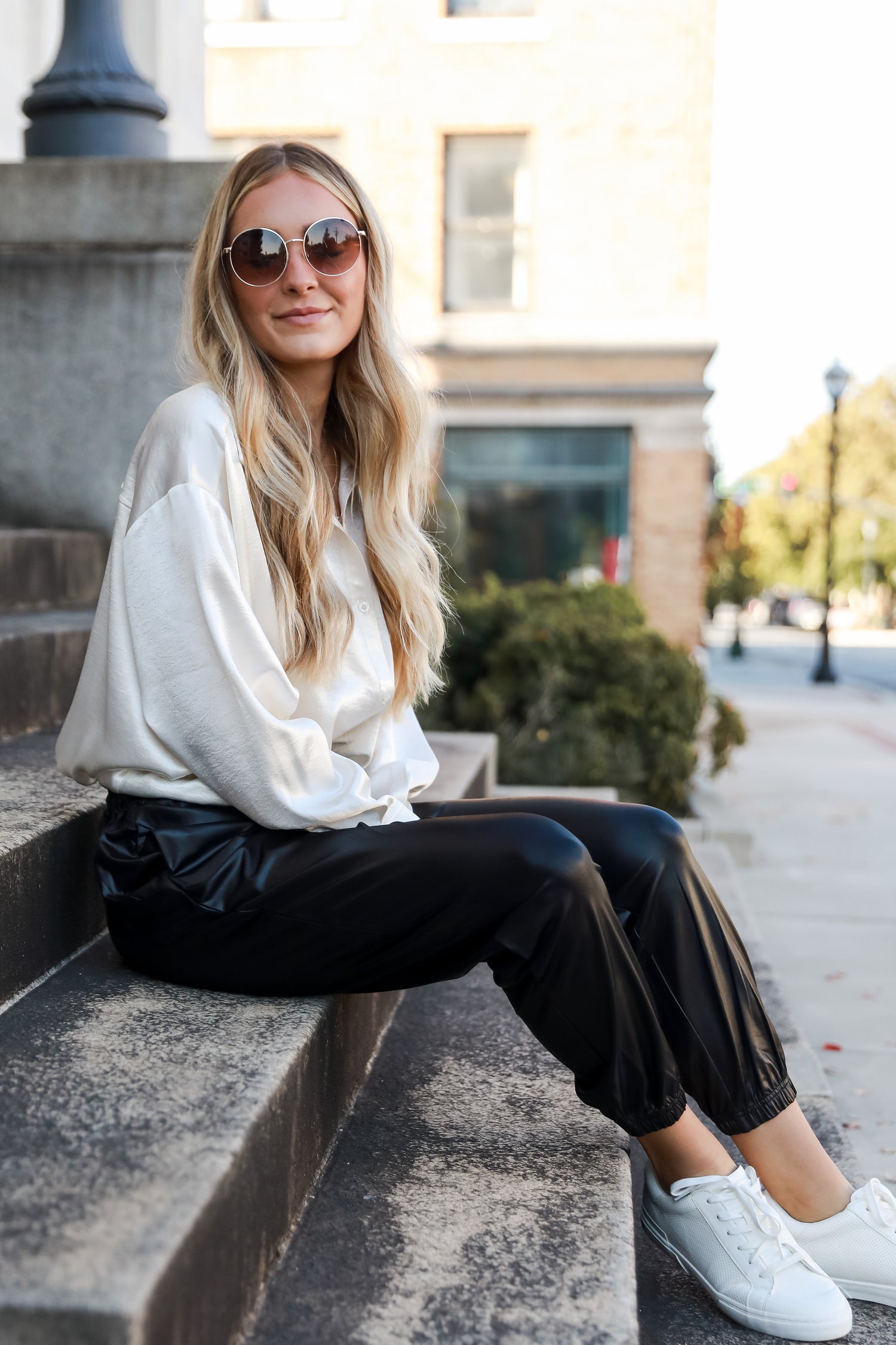 model wearing black Leather Joggers