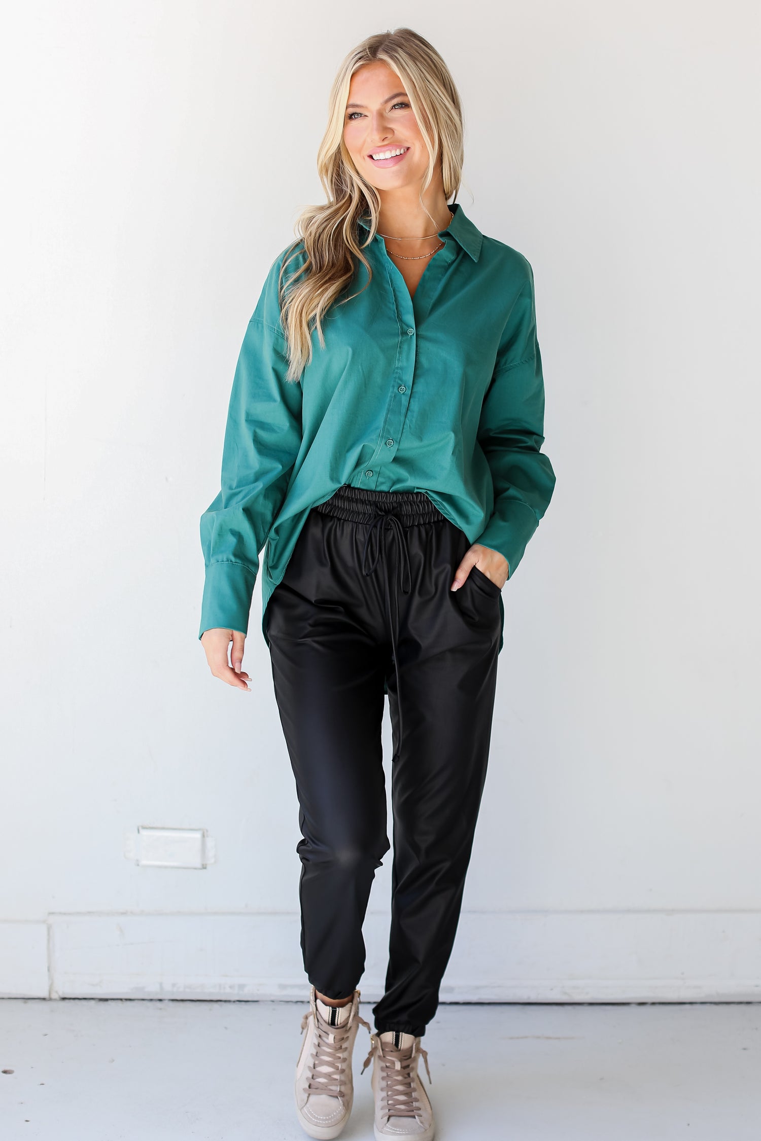 black leather joggers on model