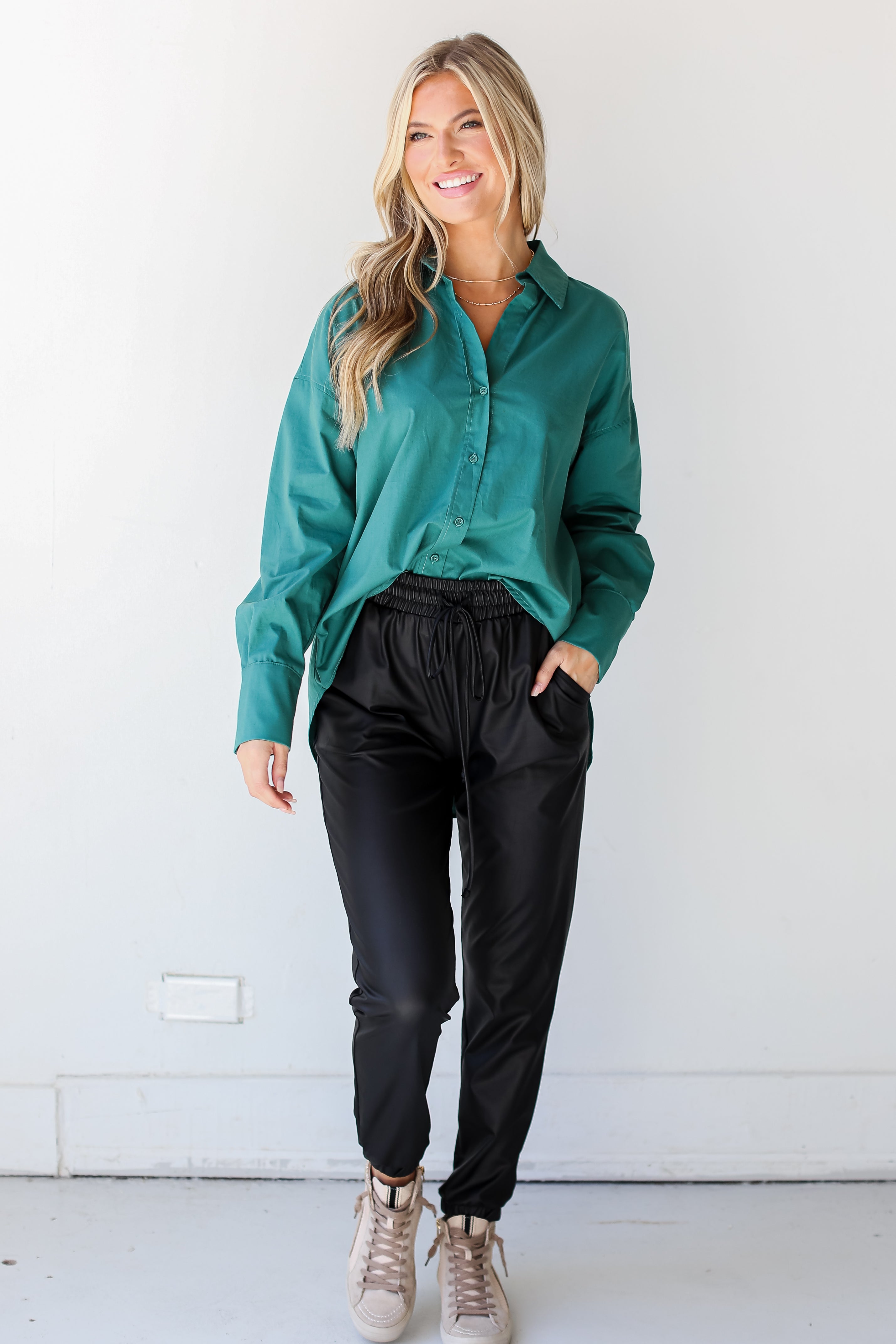 black leather joggers on model