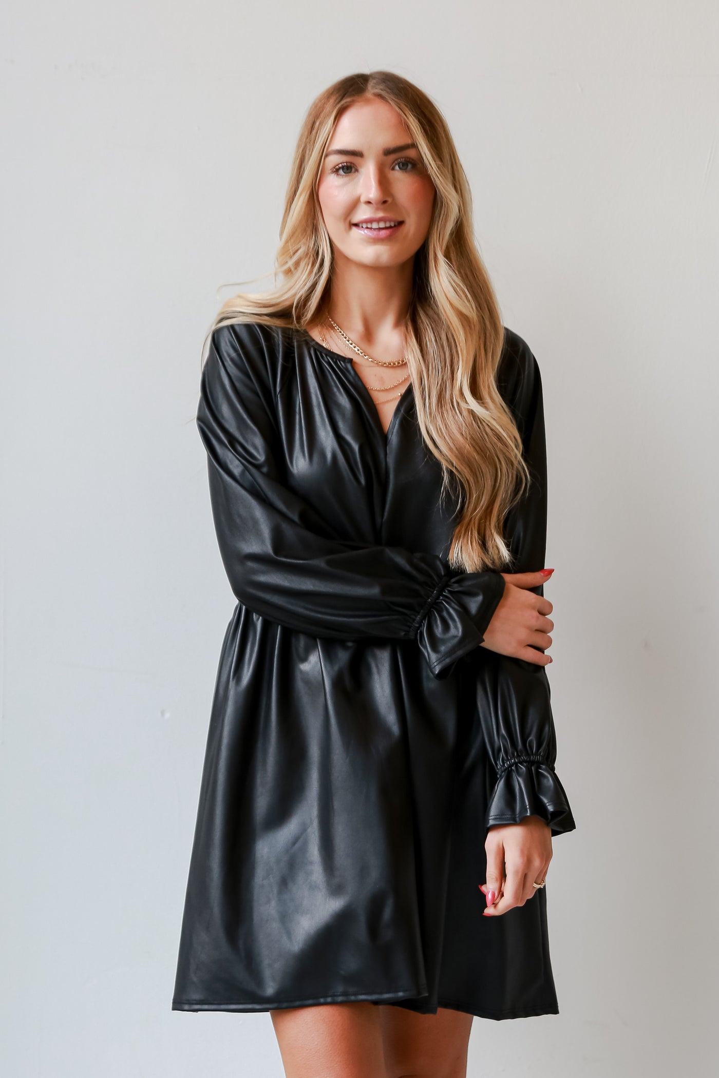 Black Leather Babydoll Mini Dress on model