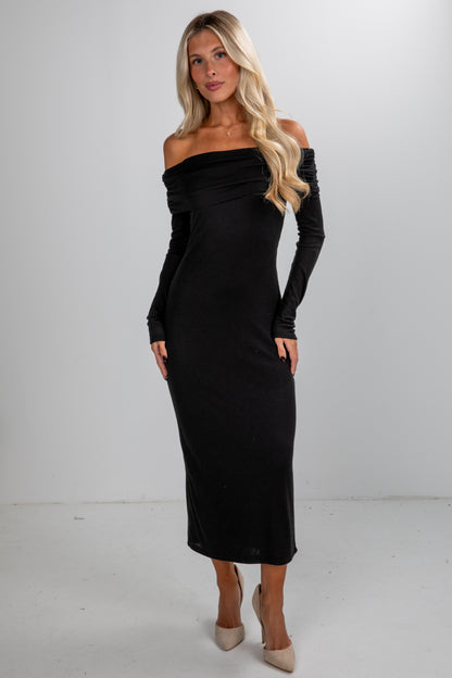 Woman wearing a black off-shoulder dress on a white background