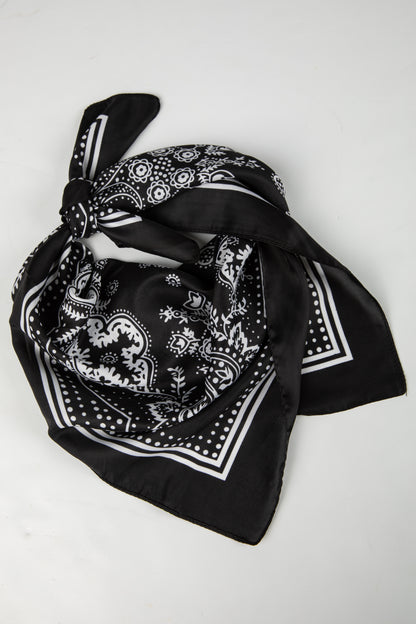 Black bandana with white patterns on a white background