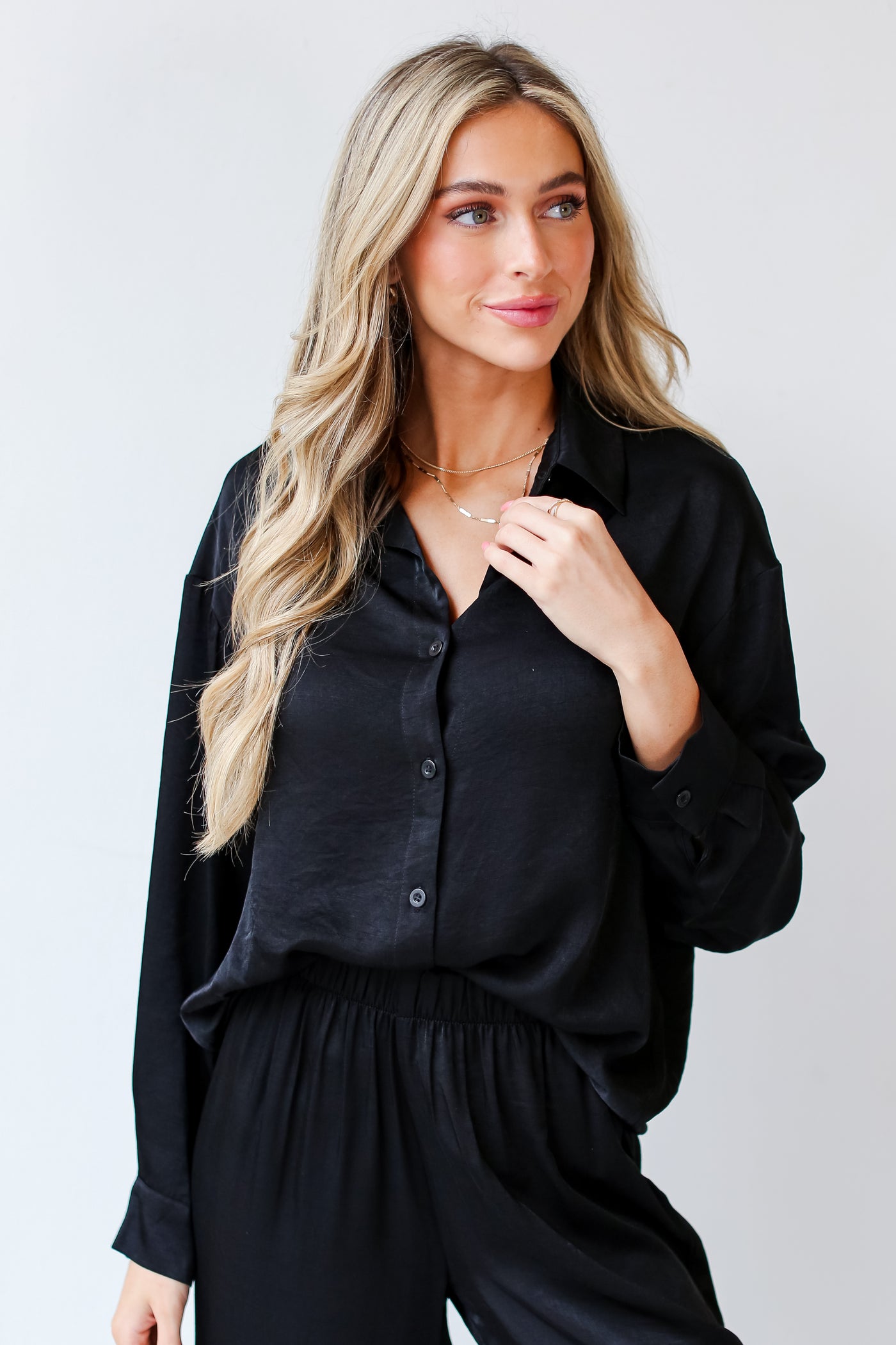 black Button-Up Blouse tucked in