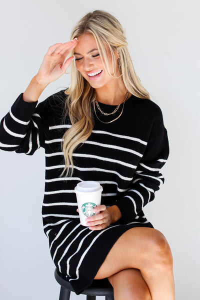 black + white Striped Sweater Mini Dress on model sitting