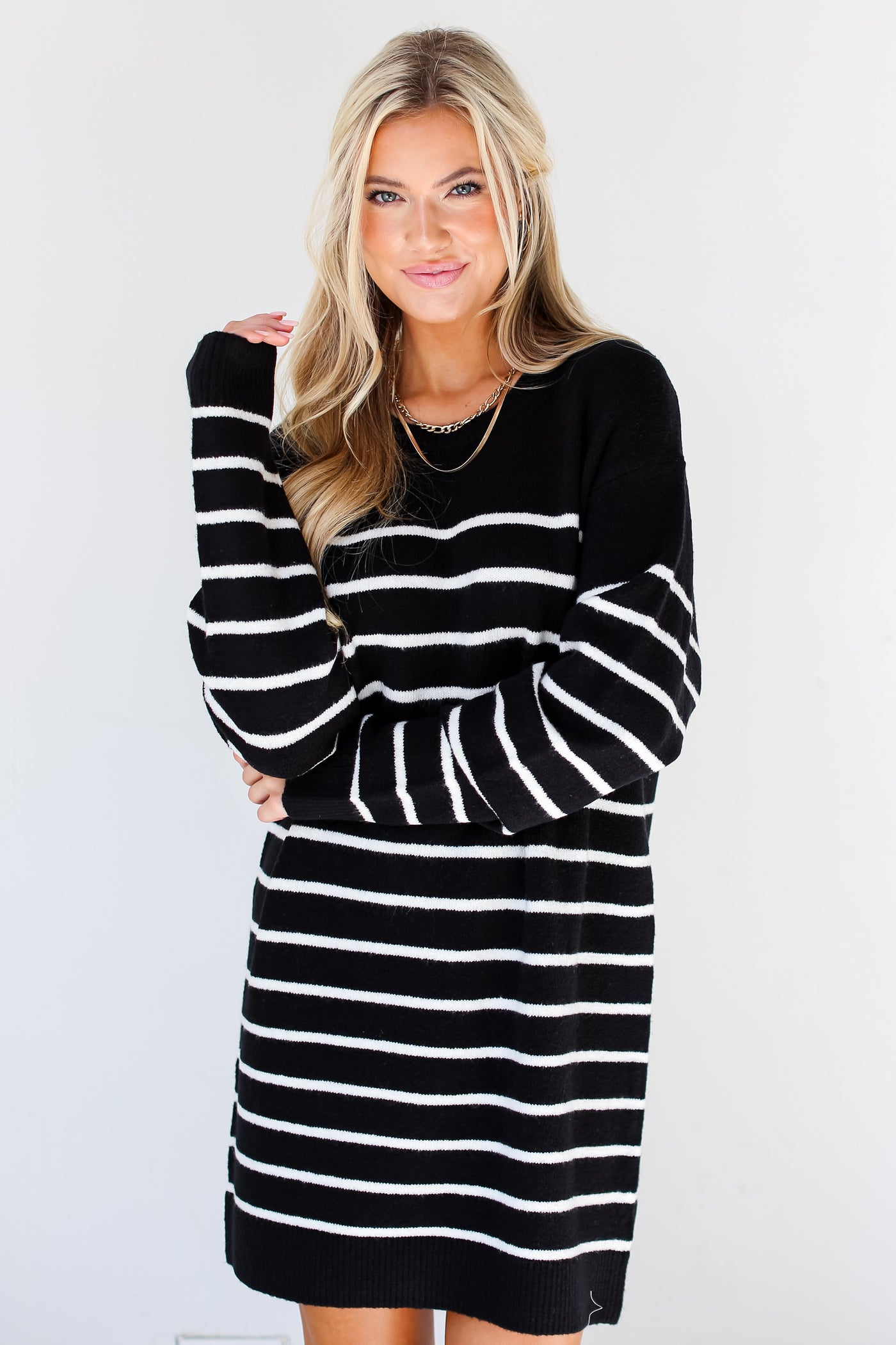 black + white Striped Sweater Mini Dress on model with gold necklaces