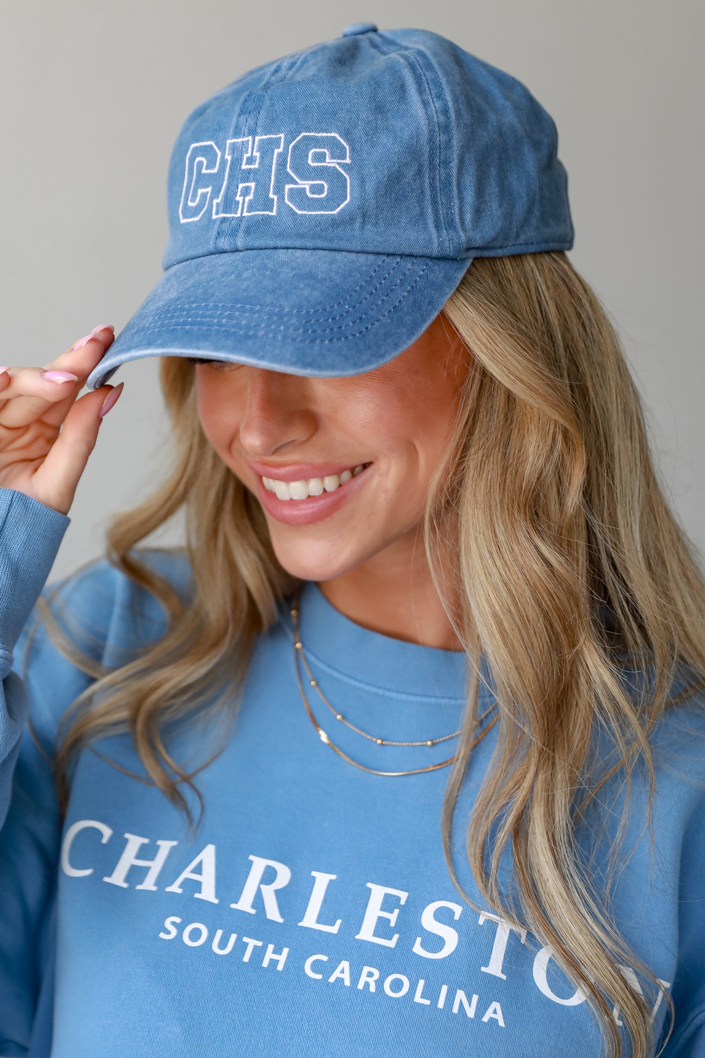 blue CHS Embroidered Hat on model