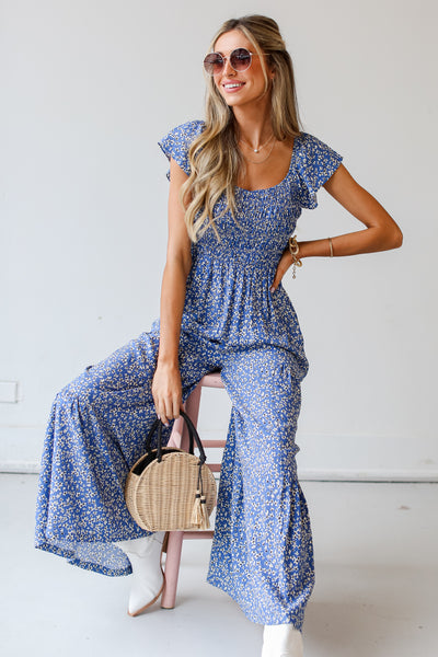 blue Floral Jumpsuit on model with sunglasses