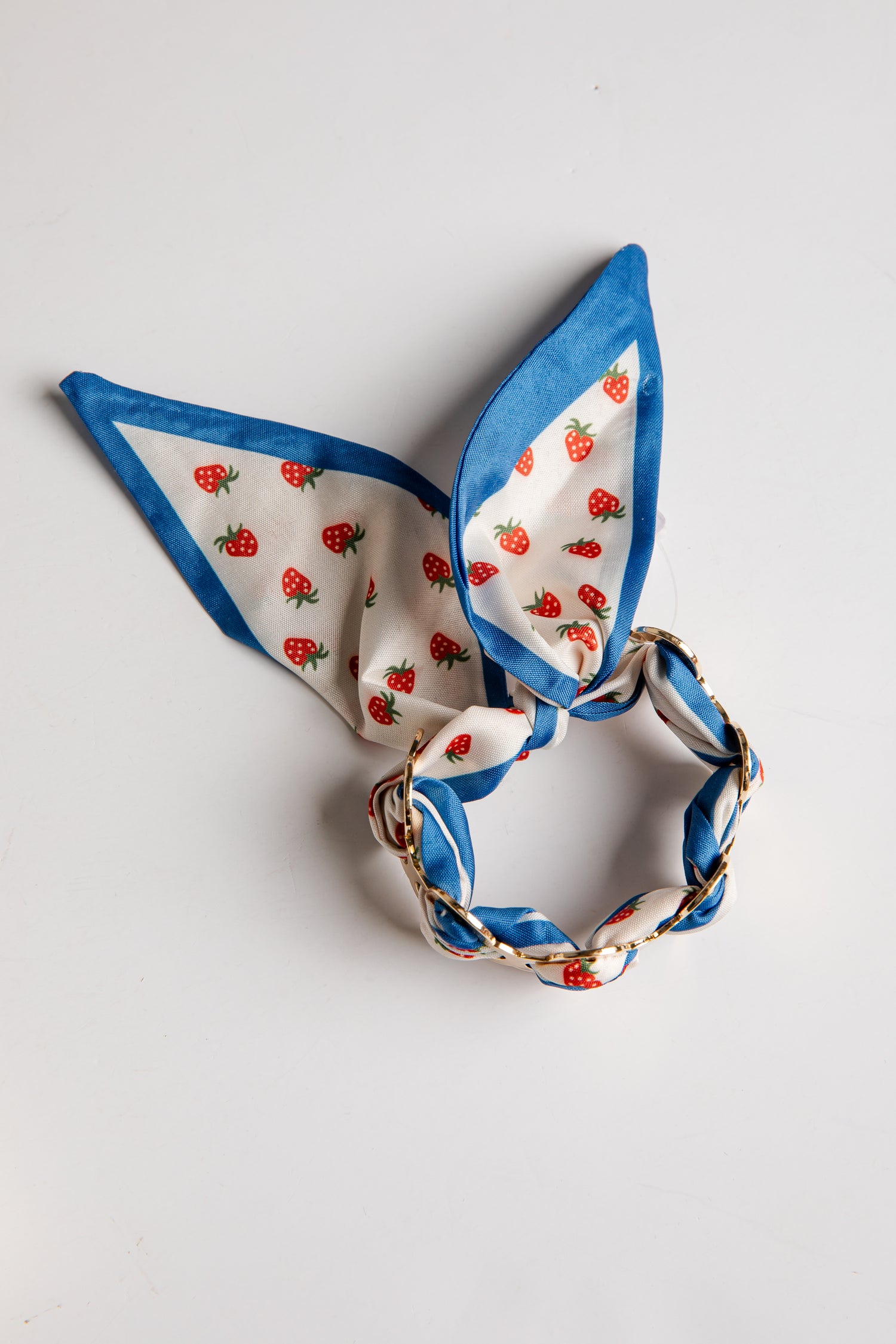 Decorative bracelet with strawberry pattern on a white background