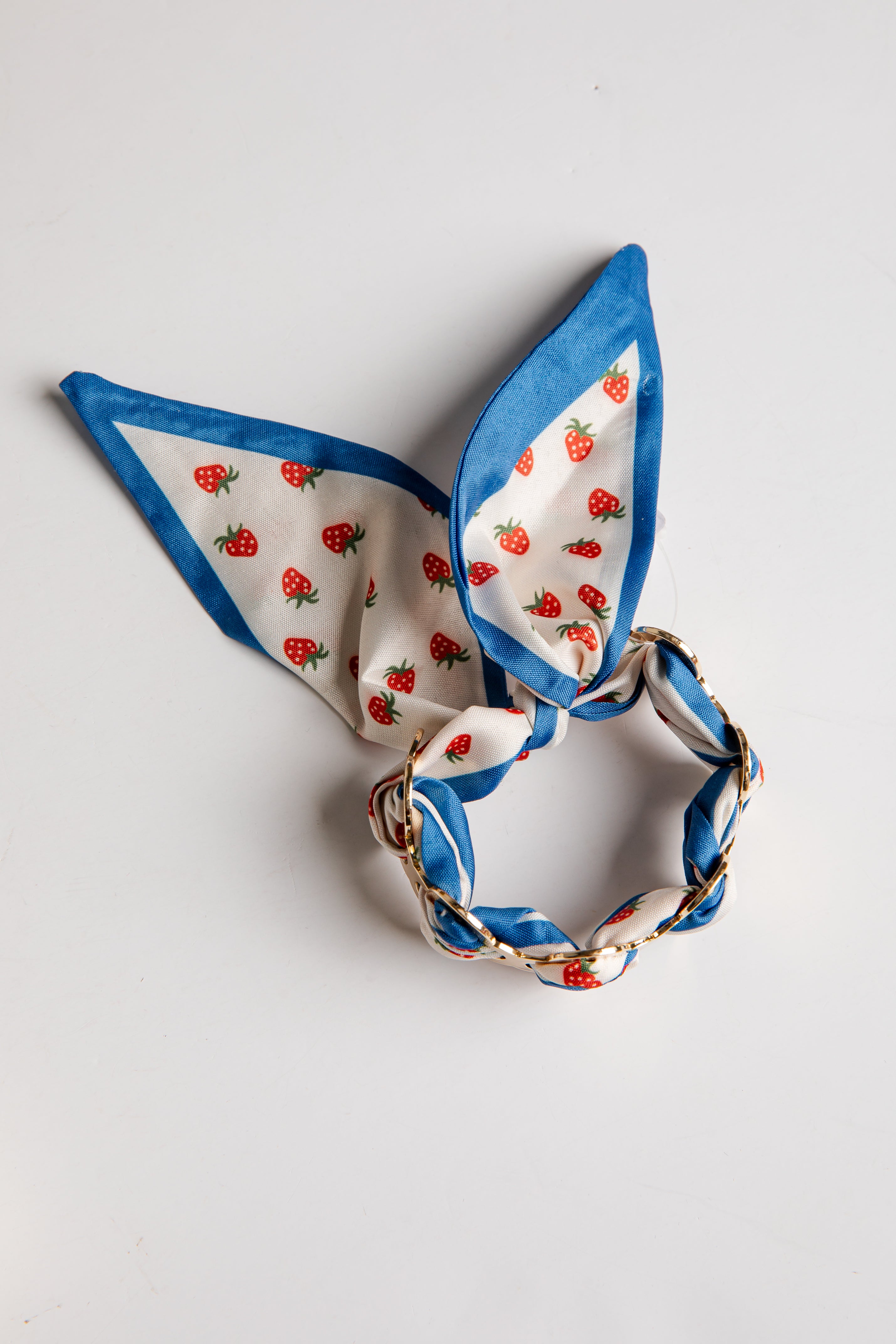 Decorative bracelet with strawberry pattern on a white background