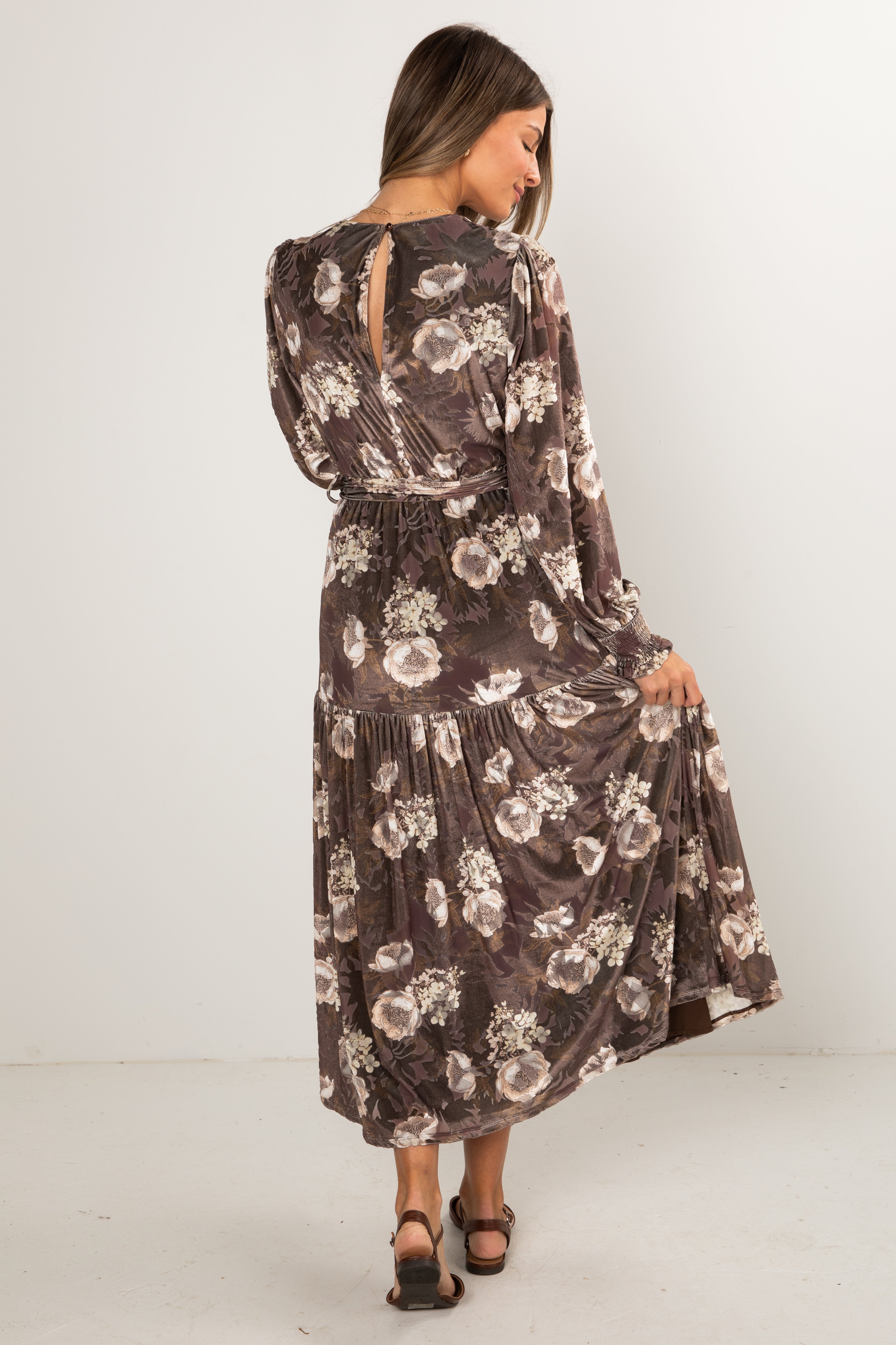 Woman wearing a floral dress on a white background