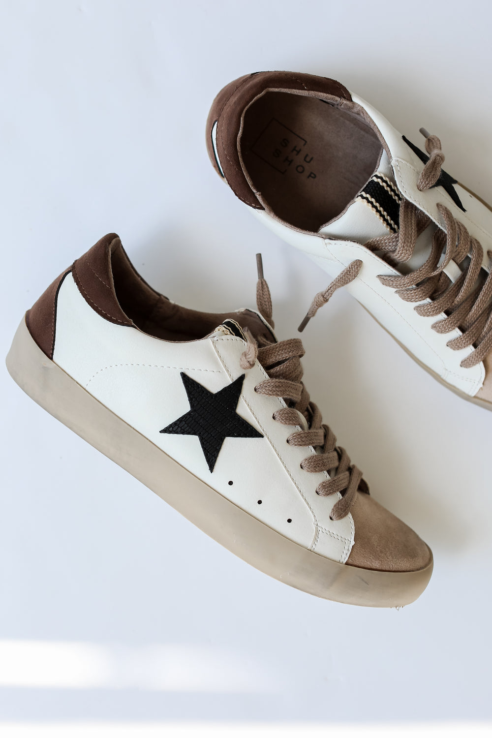 brown Star Sneakers flat lay