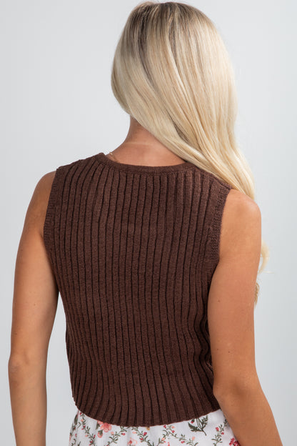 Brown ribbed sleeveless top worn by a person on a plain background
