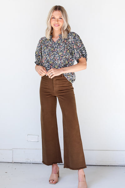 brown Wide Leg Jeans on model with a floral blouse
