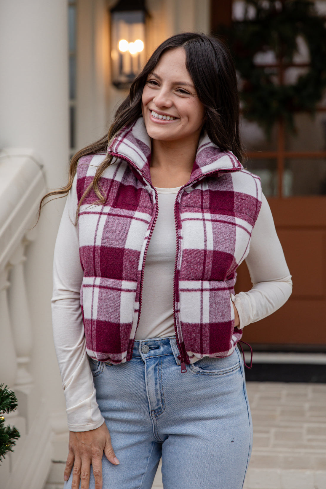 Woman wearing a plaid vest outdoors