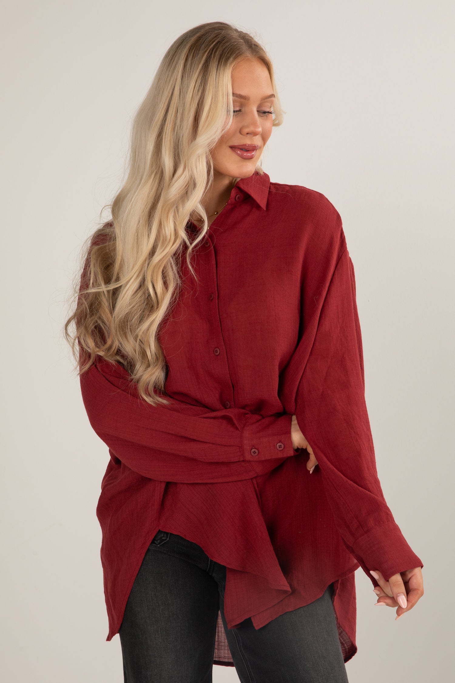 Woman wearing a red shirt with a white background