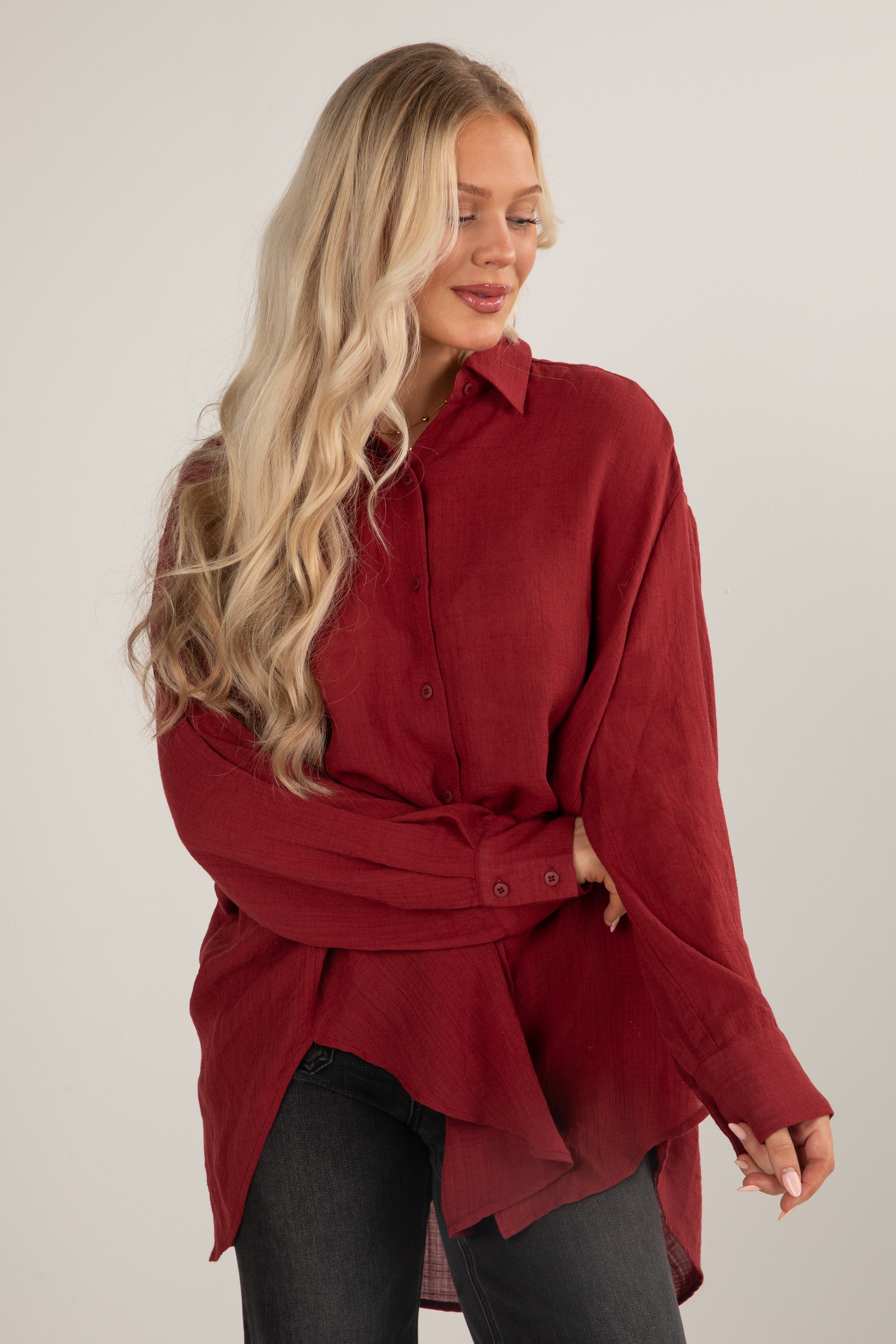 Woman wearing a red shirt with a white background