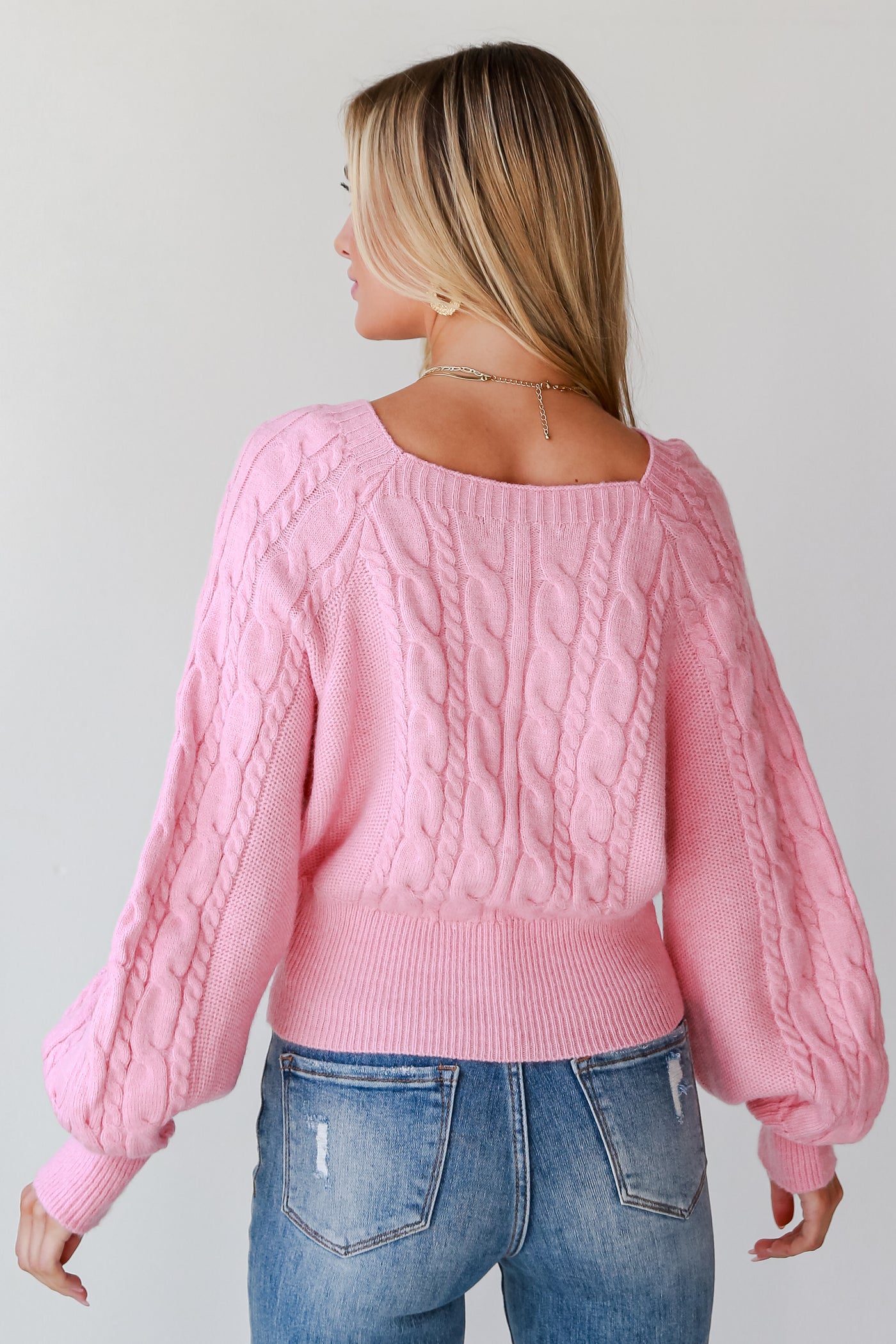 pink sweaters