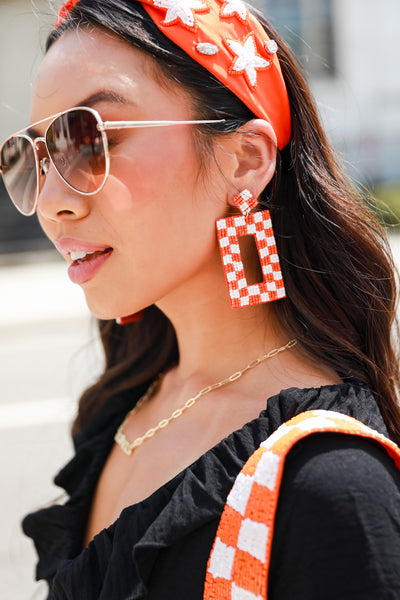 Orange + White Checkered Beaded Statement Earrings on model