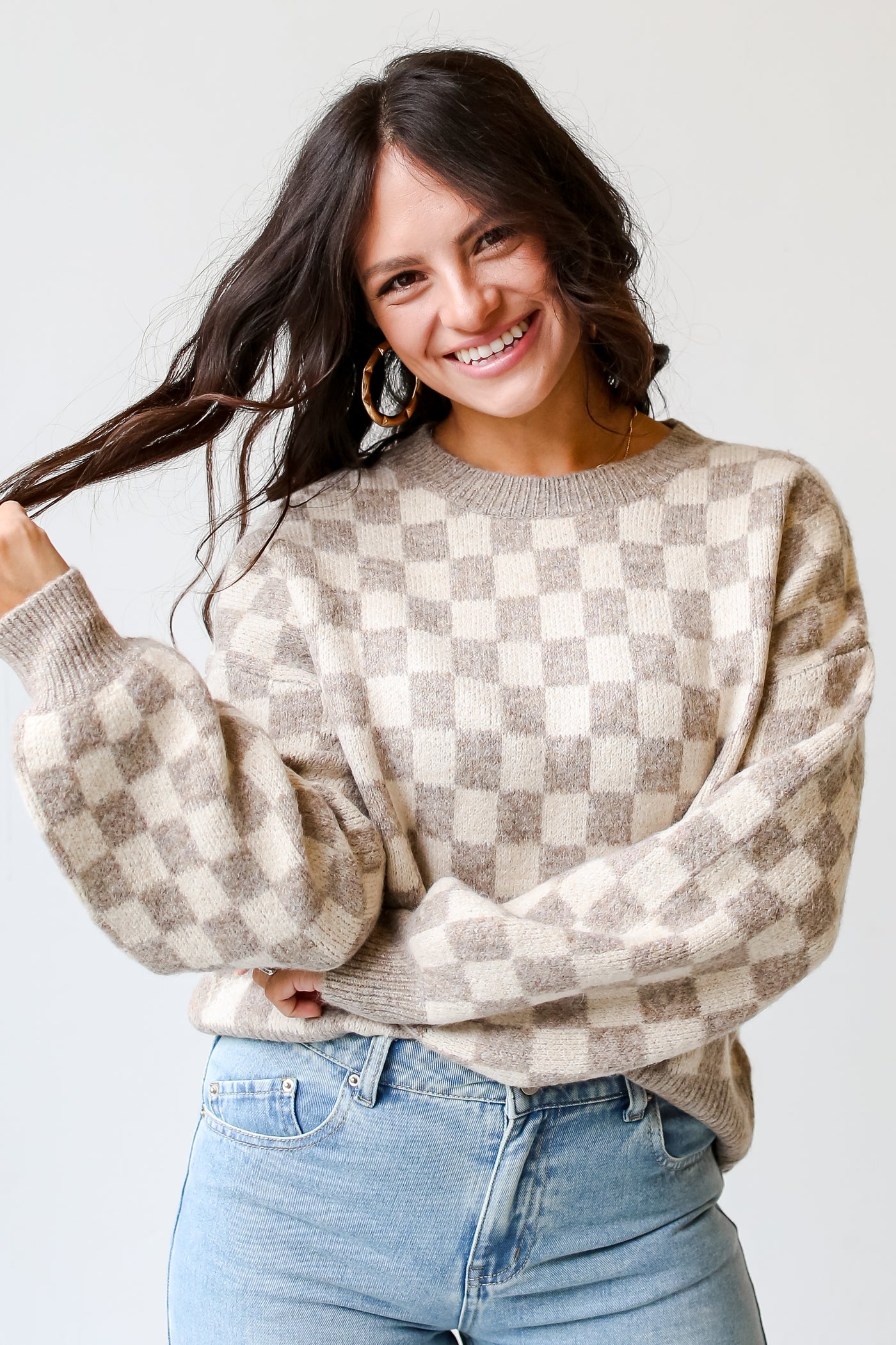 dress up model wearing a taupe Checkered Sweater