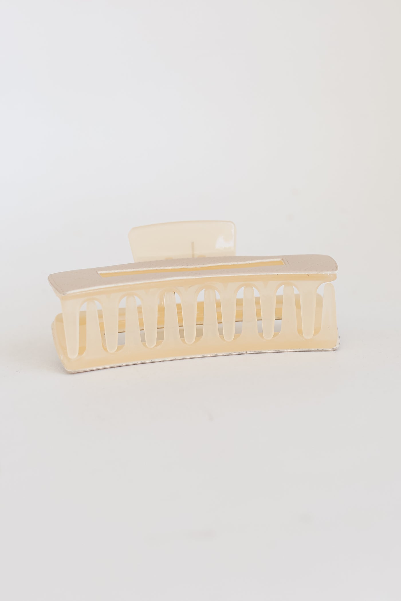 cream Quilted Acrylic Claw Hair Clip flat lay