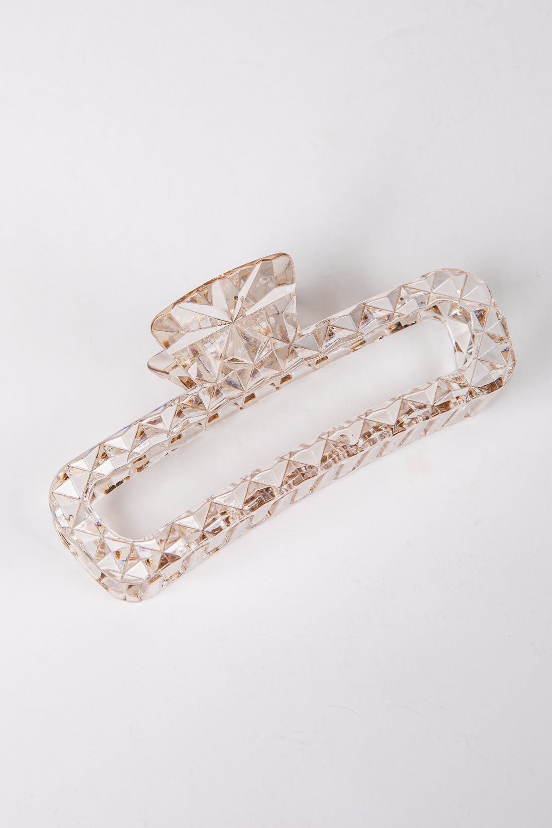 Decorative crystal hair clip on a light gray background