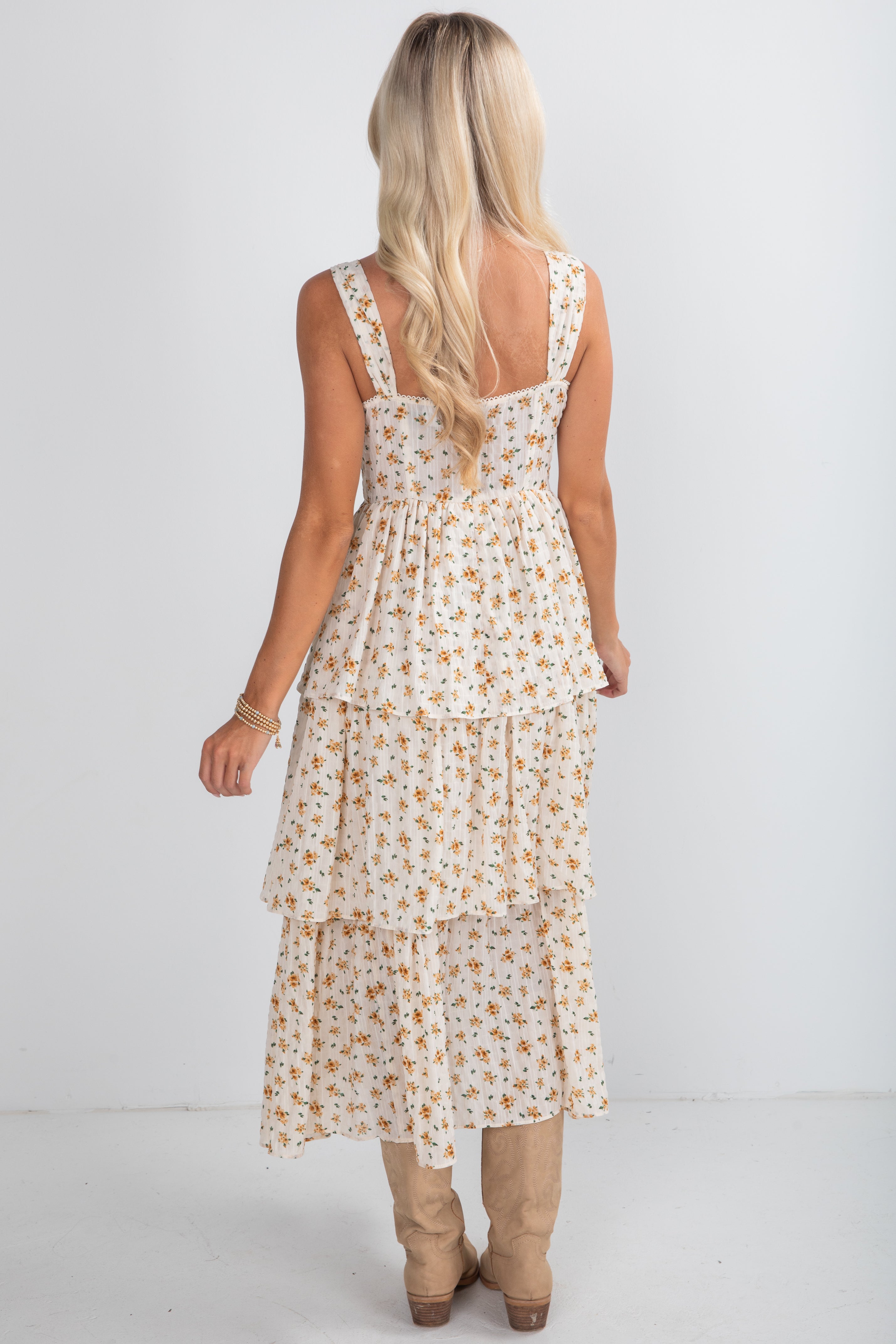 Woman wearing a floral dress on a white background