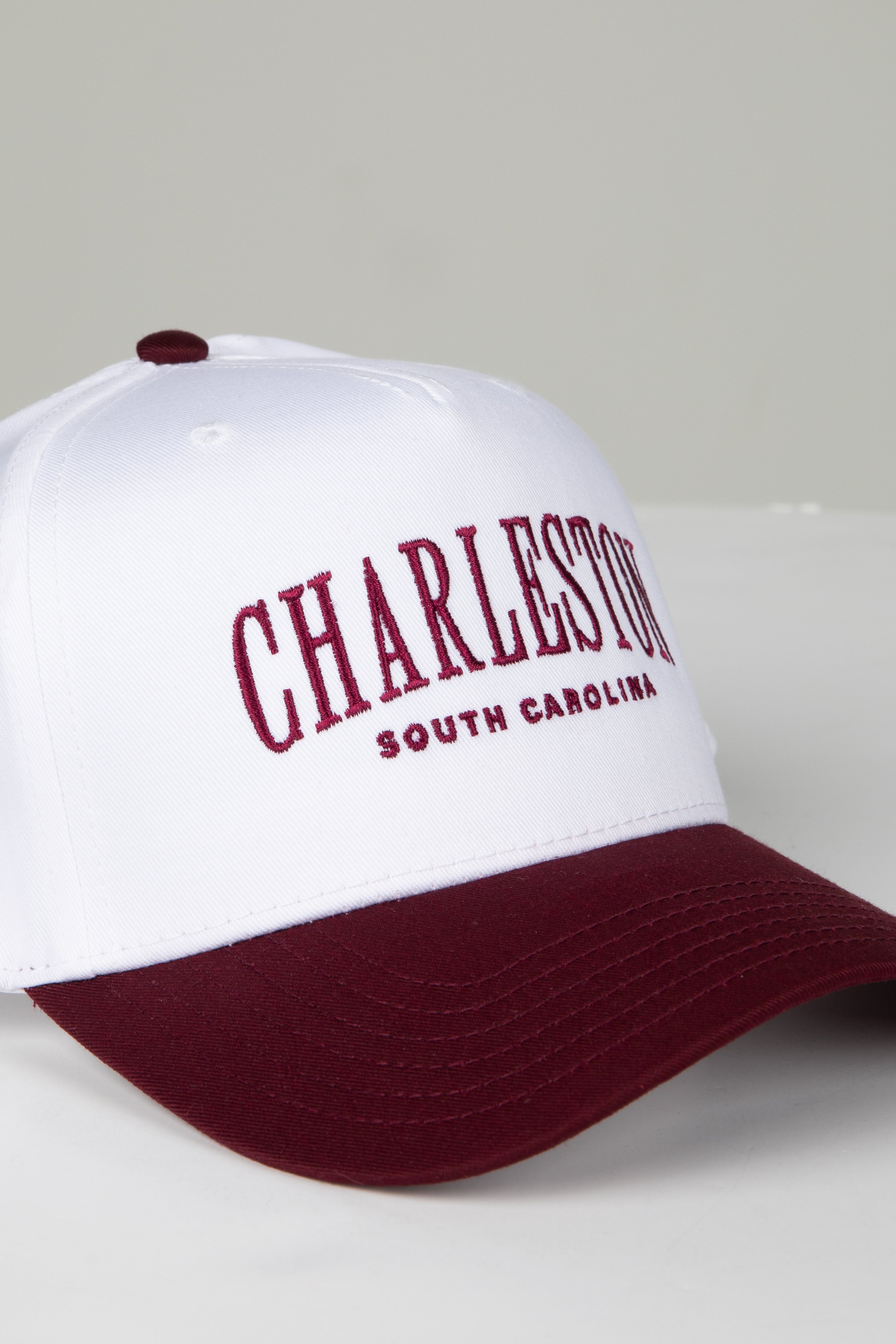 White and maroon cap with &