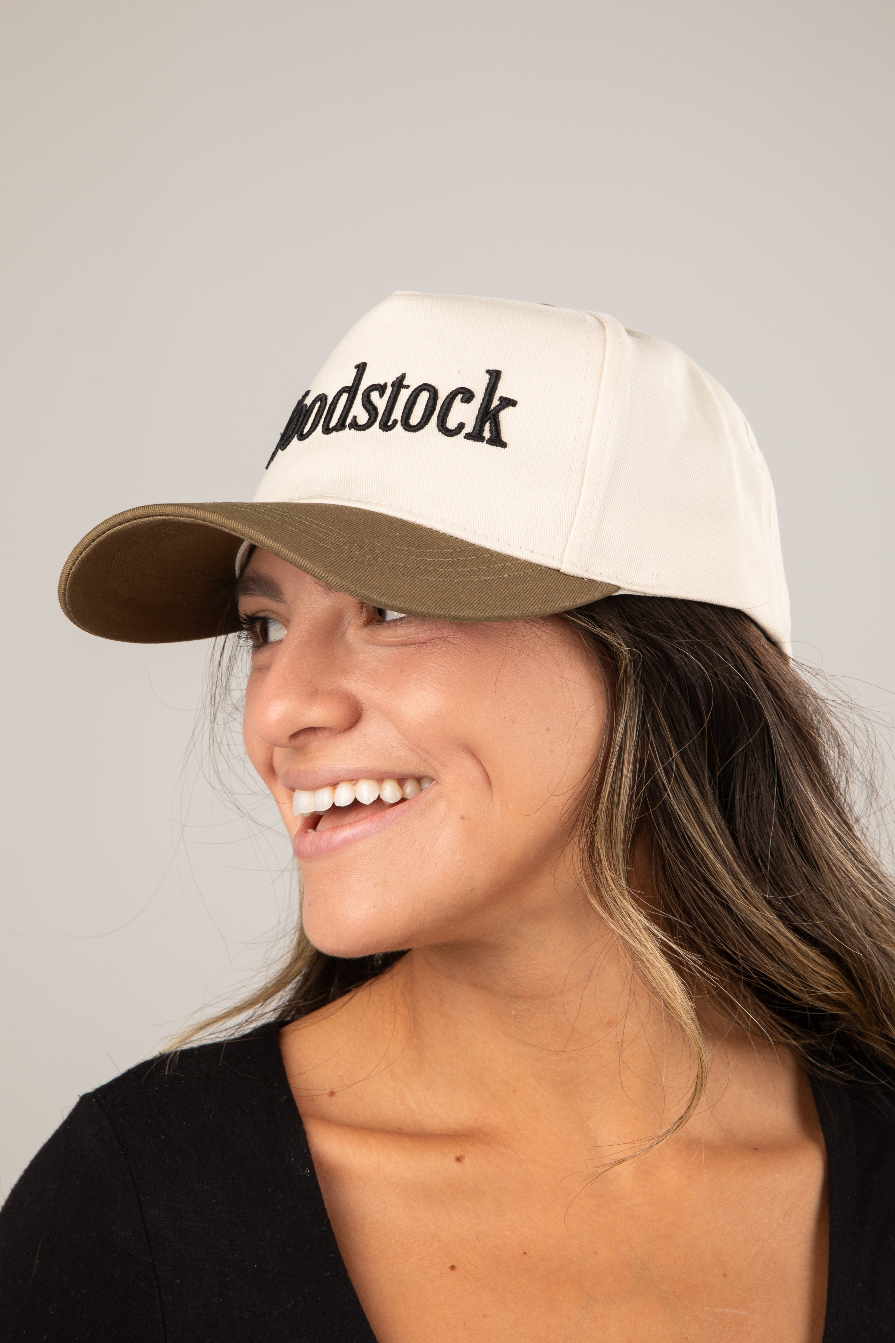 Woman wearing a cap with &