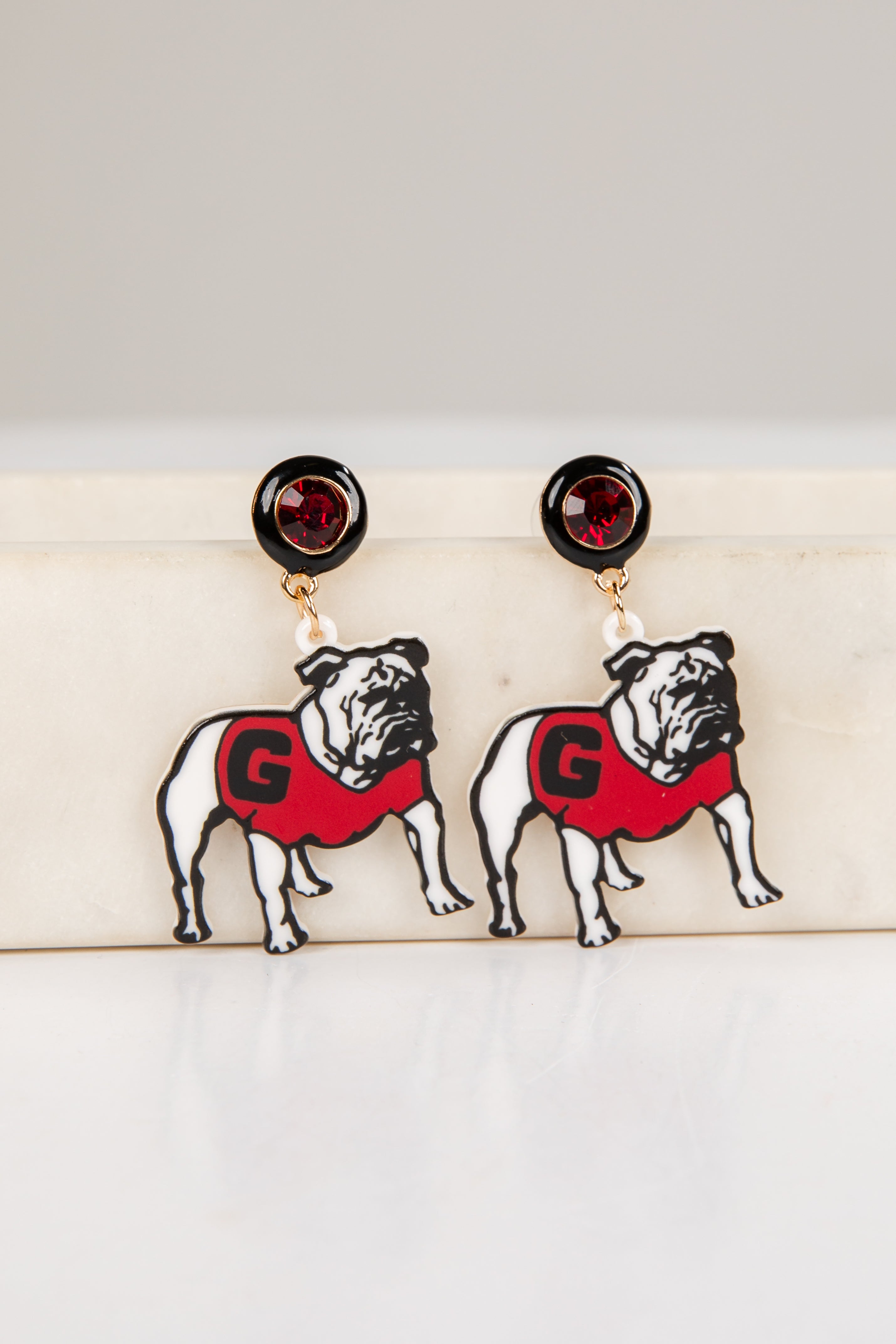 Pair of bulldog earrings with red &