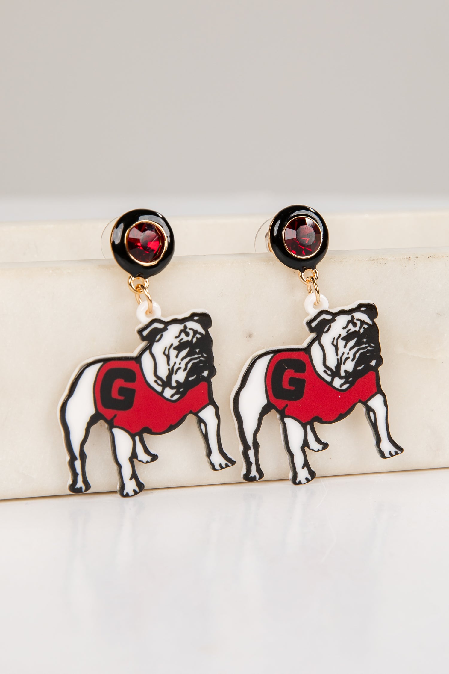 Pair of bulldog earrings with red &