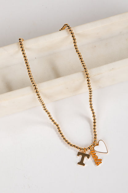 Gold necklace with letter &