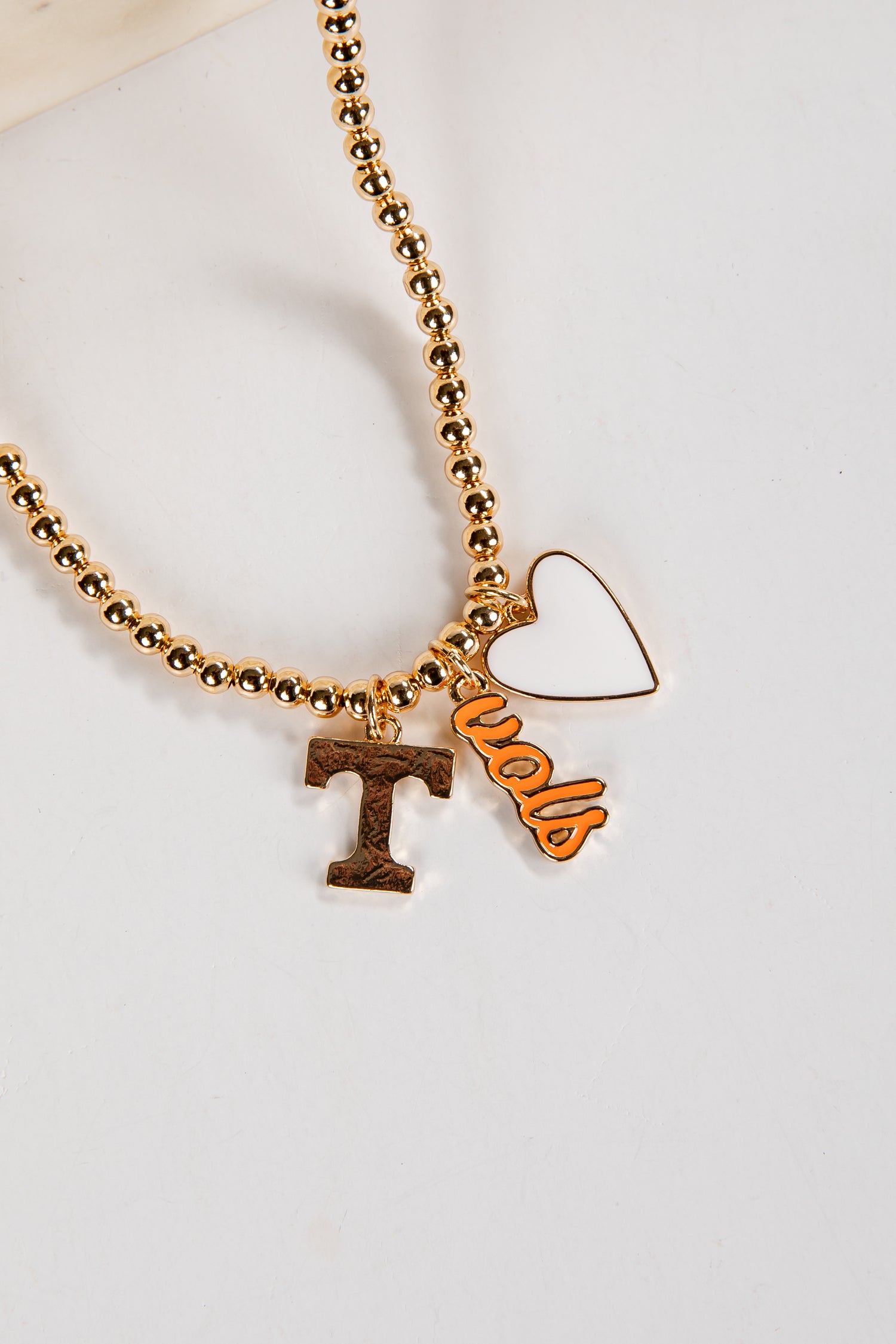 Gold beaded necklace with &