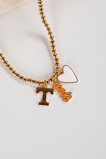 Gold beaded necklace with &