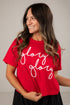 Woman wearing a red t-shirt with &