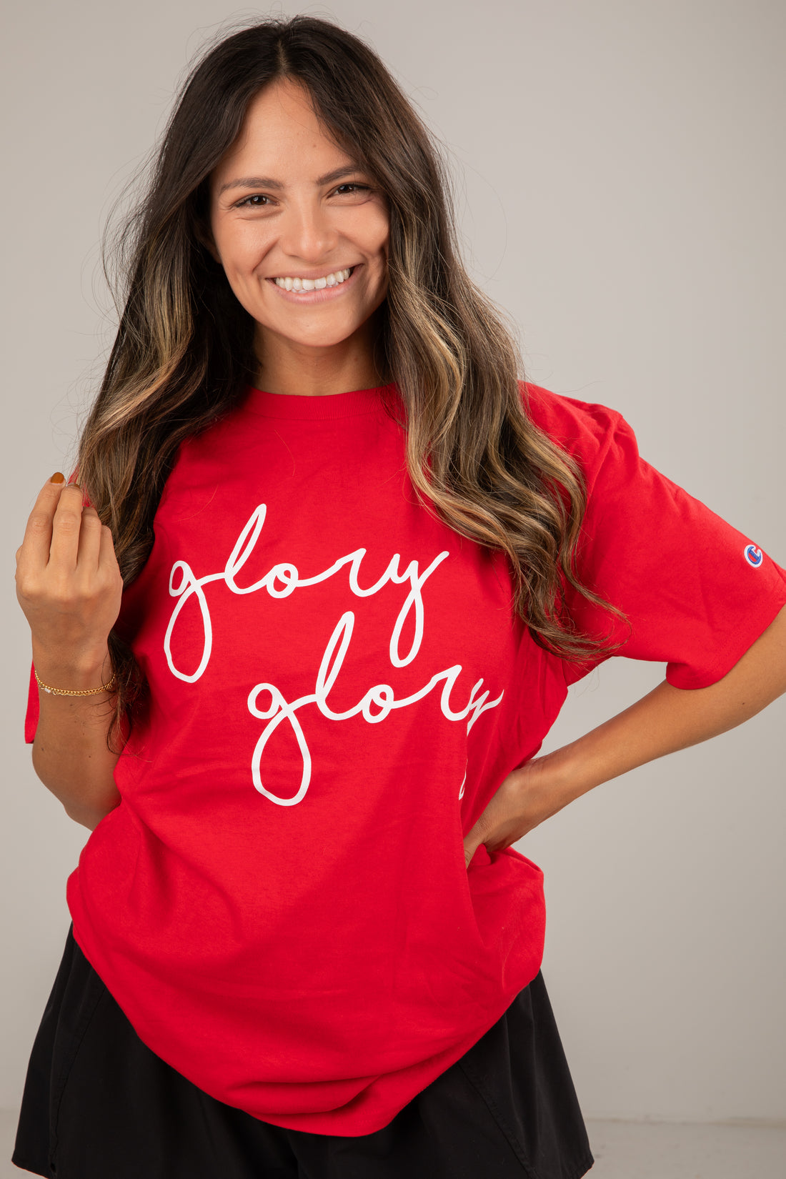 Woman wearing a red t-shirt with &