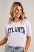 A woman wearing a light heather gray cropped t-shirt with &