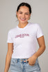 Woman wearing a white t-shirt with &