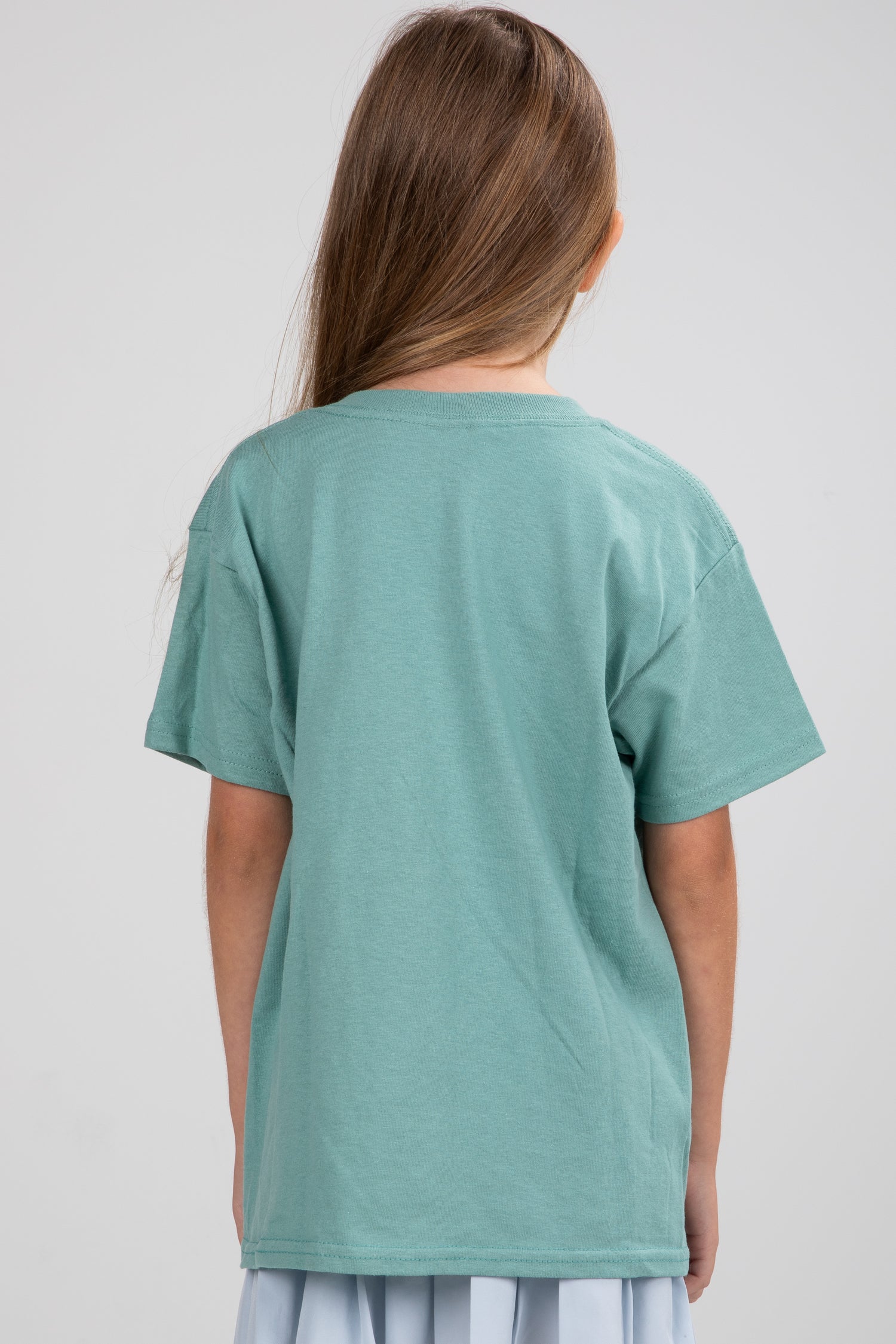 Person wearing a teal t-shirt on a plain background