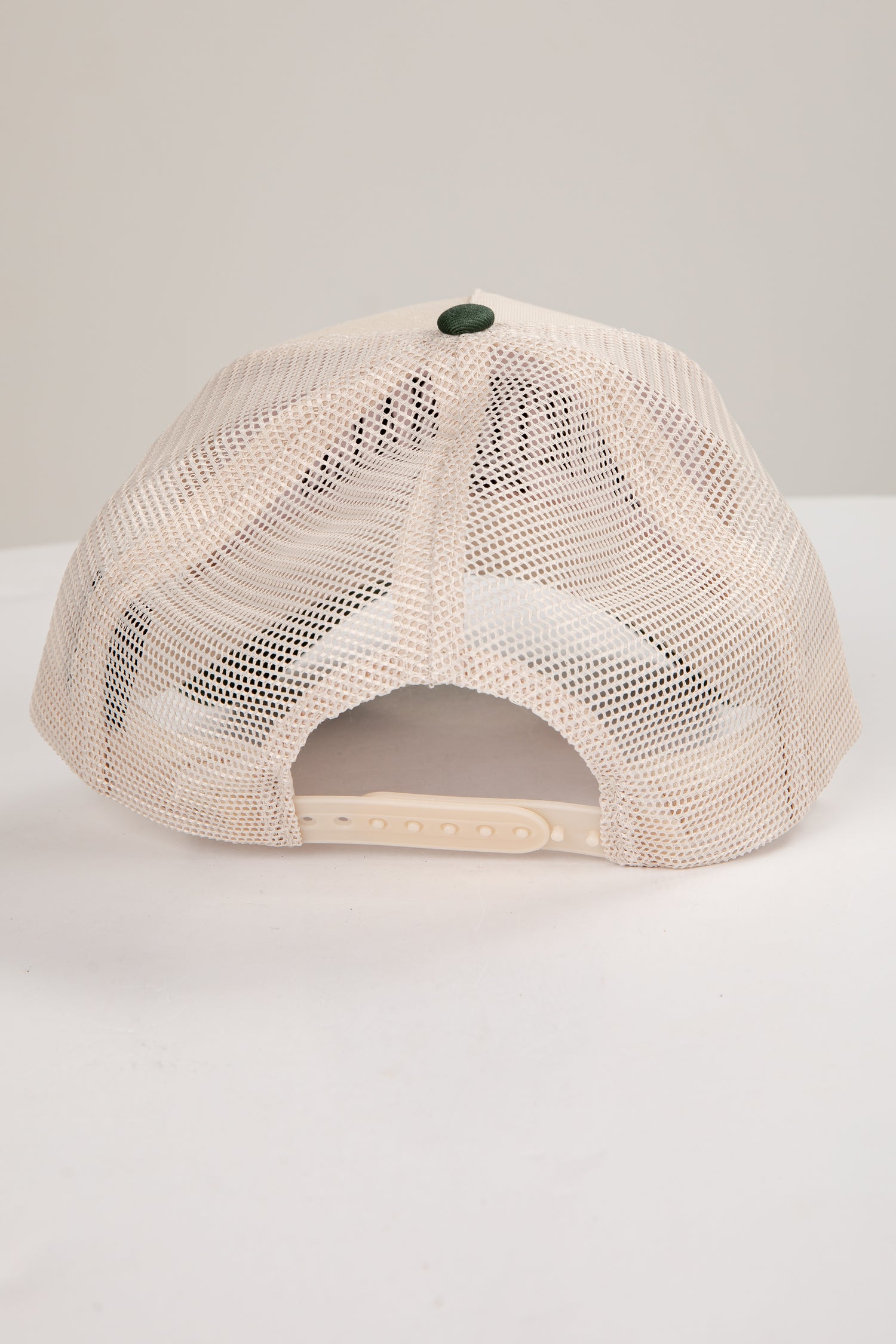 Beige mesh cap on a white background