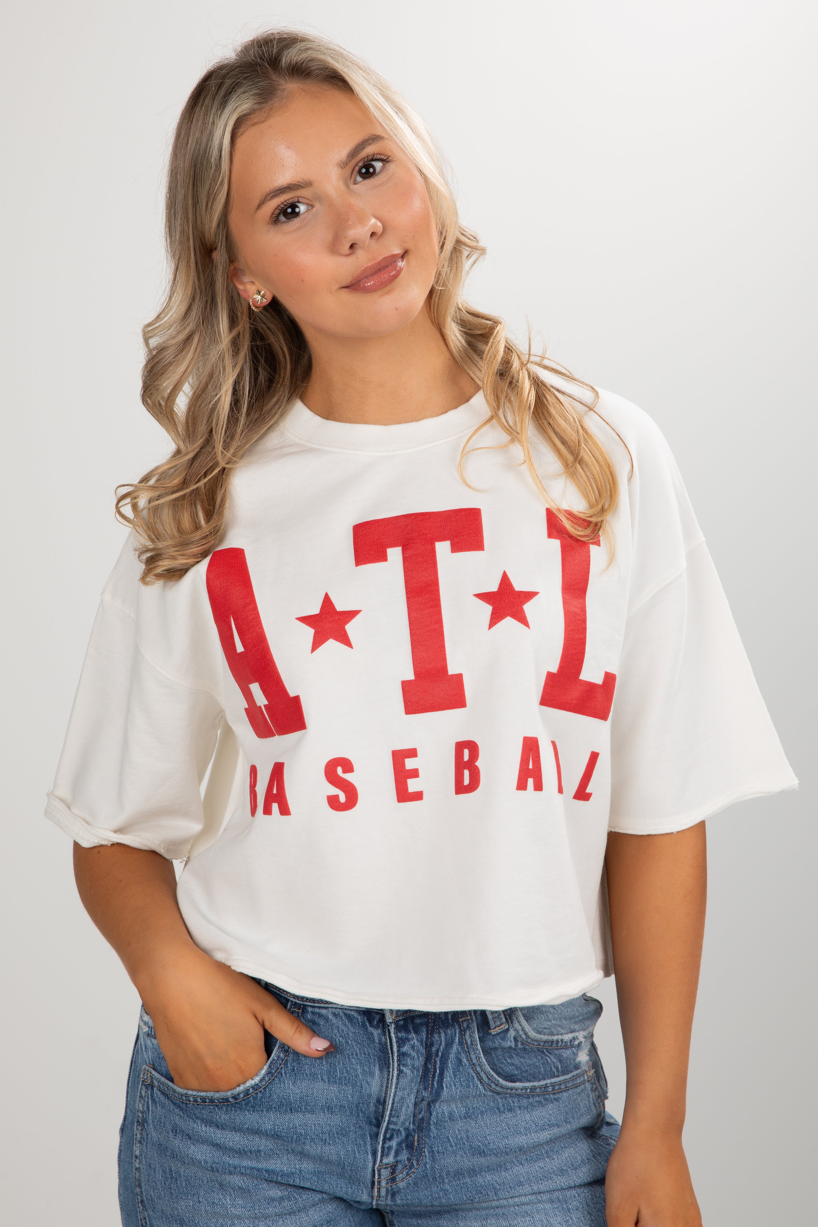 Woman wearing a white t-shirt with red &