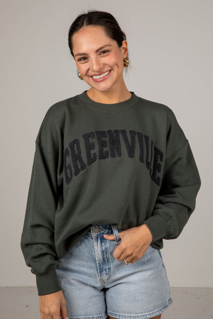 Woman wearing a green &