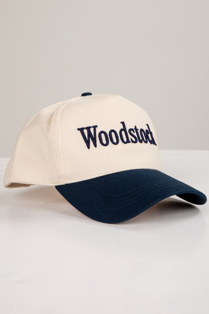 Beige and navy cap with &