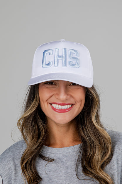 Woman wearing a white cap with &