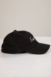 Black cap with white text on a white background