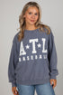 Woman wearing a blue sweatshirt with &