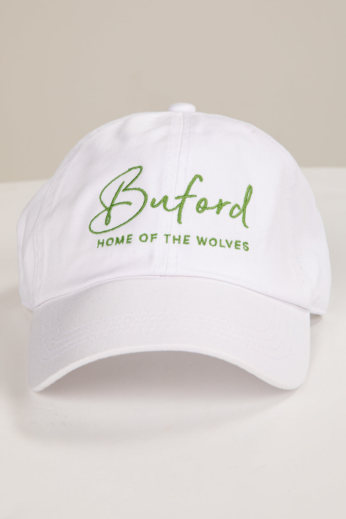 White cap with green text &